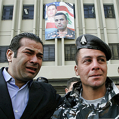 Lebanese policemen break down at the funeral of Capt. Wissam Eid, 31, one of the country's top terrorism investigators. Eid was killed by a car bomb on Jan. 25, 2008, along with his bodyguard and three others, shortly after agreeing to help UN investigators. (Hussein Malla/Associated Press)