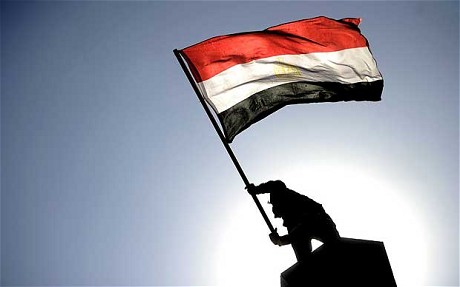Flagging support: the year ends with protests against the Egyptian army, which has become the villain of the revolution - The revolution has only just begun   