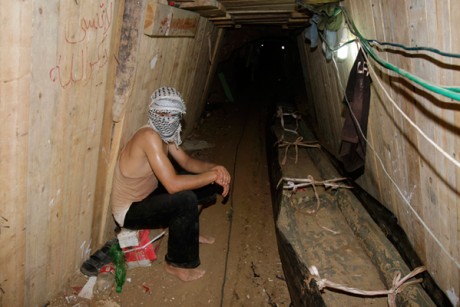 A Palestinian sits in a smuggling tunnel beneath the Egyptian-Gaza border in Rafah.