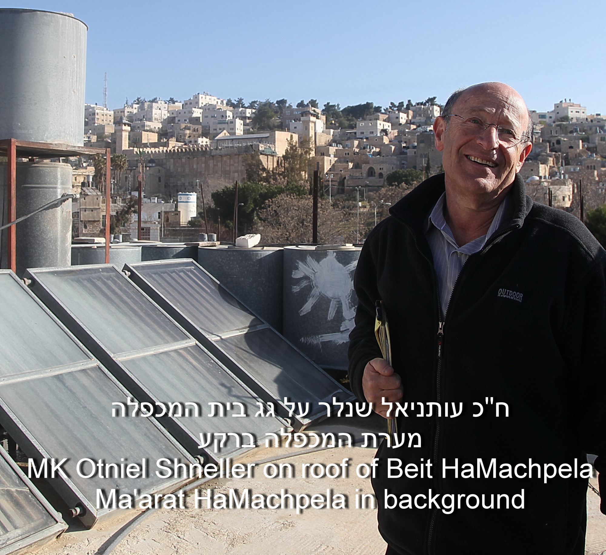 MK Otneil Shneller on the roof of Beit HaMachpela