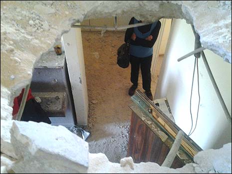 A Gaza rocket left a gaping hole in the floor and ceiling of the Leibovitzs' Ashkelon apartments.