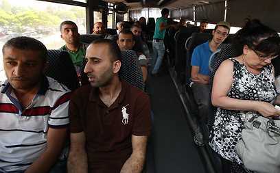 Palestinian and Israeli passengers on bus to Ariel, Wednesday. The bleeding conflict can only be solved by making peace on the ground, not through documents detached from reality (Photo: Shaul Golan) 