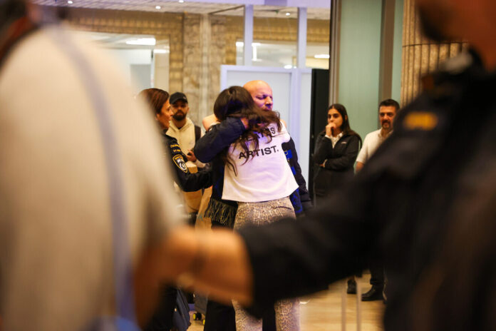 Fans of the Maccabi Tel Aviv soccer team who flew on El Al rescue flight from Amsterdam arrive to the arrivals hall of the Ben-Gurion International Airport in Israel on Nov. 8, 2024. Photo by Jonathan Shaul/Flash90.